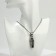 The pendant "coffin" with a skeleton, black color in black silver, l = 70 cm