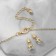 Set 2 objects: earrings, pendant "tooth", white-pink color in gold, 40 cm