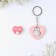 The gift set “Kus is for love”, badge + keychain, 8.3 x 12 cm.