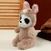 Soft toy "Panda" in a bunny suit, 25 cm