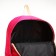 Young backpack from a lightning textile, 2 pockets, raspberry color