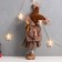 Interior doll "Girl in a brown fur coat and hat with asterisk" 20x11x47 cm