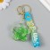 A keychain plastic with a carbine, a strap "Flower with shells" Water with a decor of 1.8x5.3x5.6 cm 104732