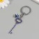 Keychain from the evil eye Metal "key with pebbles" 2.4x6.5 cm