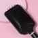 The comb is massage, wide, 8 × 25 cm, black/white color