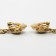 Clips "drop" wavy, black color in black gold