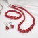 Set 3 objects: earrings, beads, bracelet "coral" ball