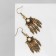 Earrings hanging "ethnic" leaves, white color in black gold, 6 cm