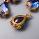 Decor for creativity Plastic "A drop with golden flowers" Blue crystal 2x1.2 cm