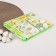 Adhesive oilcloth "Cartoons" 70x100cm., On an elastic band, with a edging, yellow/green color