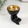 Black Polystone stand “A little man sits” black 6.7x6x6.8 cm