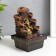 The desktop fountain from the Ganesh network at the cliff with a waterfall 18x12x12 cm