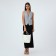 The bag is female, medium size, long belt, white color