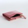 Women's wallet on the button, pink color