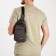 Male sling bag from textiles, headphone opening, gray color
