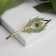 Brooch "Pen" Firebirds, colored in yellow gold