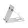 A tablet stand, adjustable, folding, rubber inserts, white