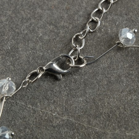 Zigzag beads transparent, d = 0.6, white color in silver, 30 cm-3