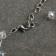 Zigzag beads transparent, d = 0.6, white color in silver, 30 cm