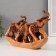 Polystone souvenir "Five elephants with a blanket on a stand" under a tree 6x22x15.5 cm