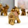 Souvenir Polystone "Seven elephants in Red Popone with pearls" h = 10.3; 9; 7.6; 7; 6.2; 5.5; 4.2 cm