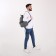 A backpack with a zipper, "saxi", outer pocket, gray color