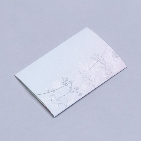 An envelope for a certificate with embossing "Happiness is" 10.5 x 7-1