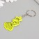A plastic key a reflective "snake in the crown" 5.5x3.2 cm