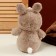 Soft toy "Panda" in a bunny suit, 25 cm
