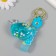 A plastic keychain with a carbine, a whale strap of water with sparkles 4x7x2.5 cm