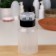 Board with pomp, 250 ml, black/transparent color