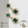 Earrings with “openwork” rhinestones duet, emerald color in gold