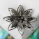 Galiotis brooch-column magnolia, green color in black silver