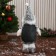 Soft toy "Santa Claus in a suit with a strap, long legs" stands, white-gray