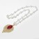 Piece with pearls "drop" is large, the color is red-white in gold, 70 cm