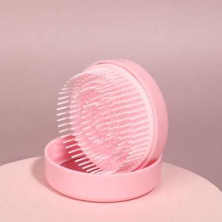 The comb is massage, round, folding, with a mirror, d = 7.5 cm, in the box, the color is pink-8
