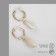 Earrings "sea" with shells, beige color in gold