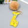 Fluffy on a ring with a carbine "Giraffe with beige pompon" d = 8 cm