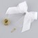 A bell on a pin with a bow for graduation, white, d = 2.6 cm