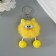 Fluffy on the ring "oblique eyes" yellow 9.5x6x6 cm
