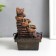 The desktop fountain from the Ganesh network at the cliff with a waterfall 18x12x12 cm
