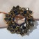 Brooch "Empress" circle with roses, the color is gray-blue in black gold