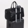 Road bag with a zipper, a suitcase holder, a long belt, black color