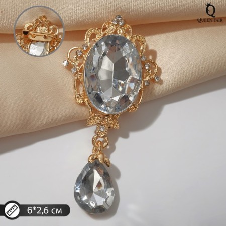 Obval brooch with a drop, white color in gold