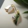 Brooch "Snowstep flower" with bead, white-green color in gold