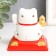 Plastic pendulum from the solar battery "White Mani-Neko with a pumpkin hog" 7x7x7.5 cm