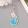 Acryl keychain "Snake in a knitted hat of a bunny" 6x3.6 cm