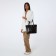 Luggage bag with a zipper, 3 external pockets, a long belt, a dark brown color