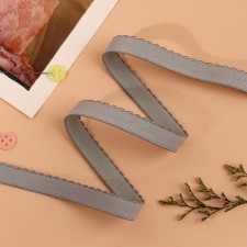 The elastic band is becoming, with an openwork edge, 10 mm, 10 ± 0.5 m, the color is gray