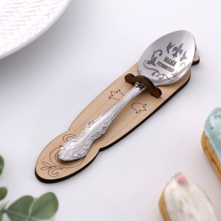 A spoon is registered, tea, with an engraving "Julia", h = 14